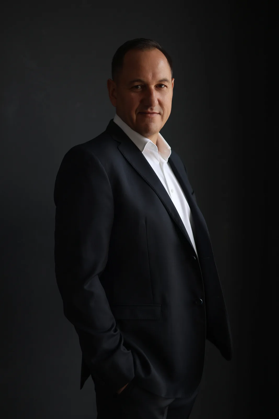 Corporate portrait in a dark suit